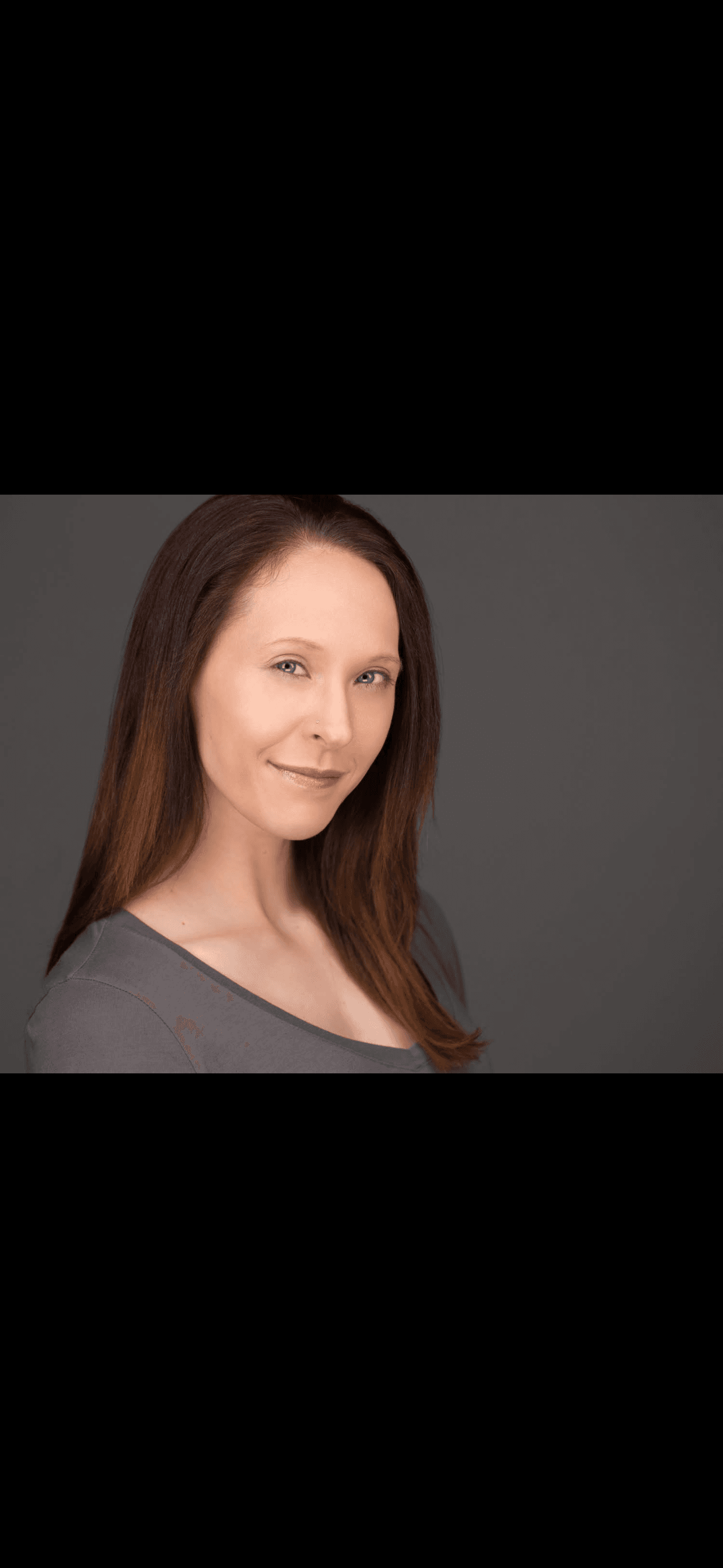 Andrea Abella Marie, lifestyle and wellness coach, in a studio portrait